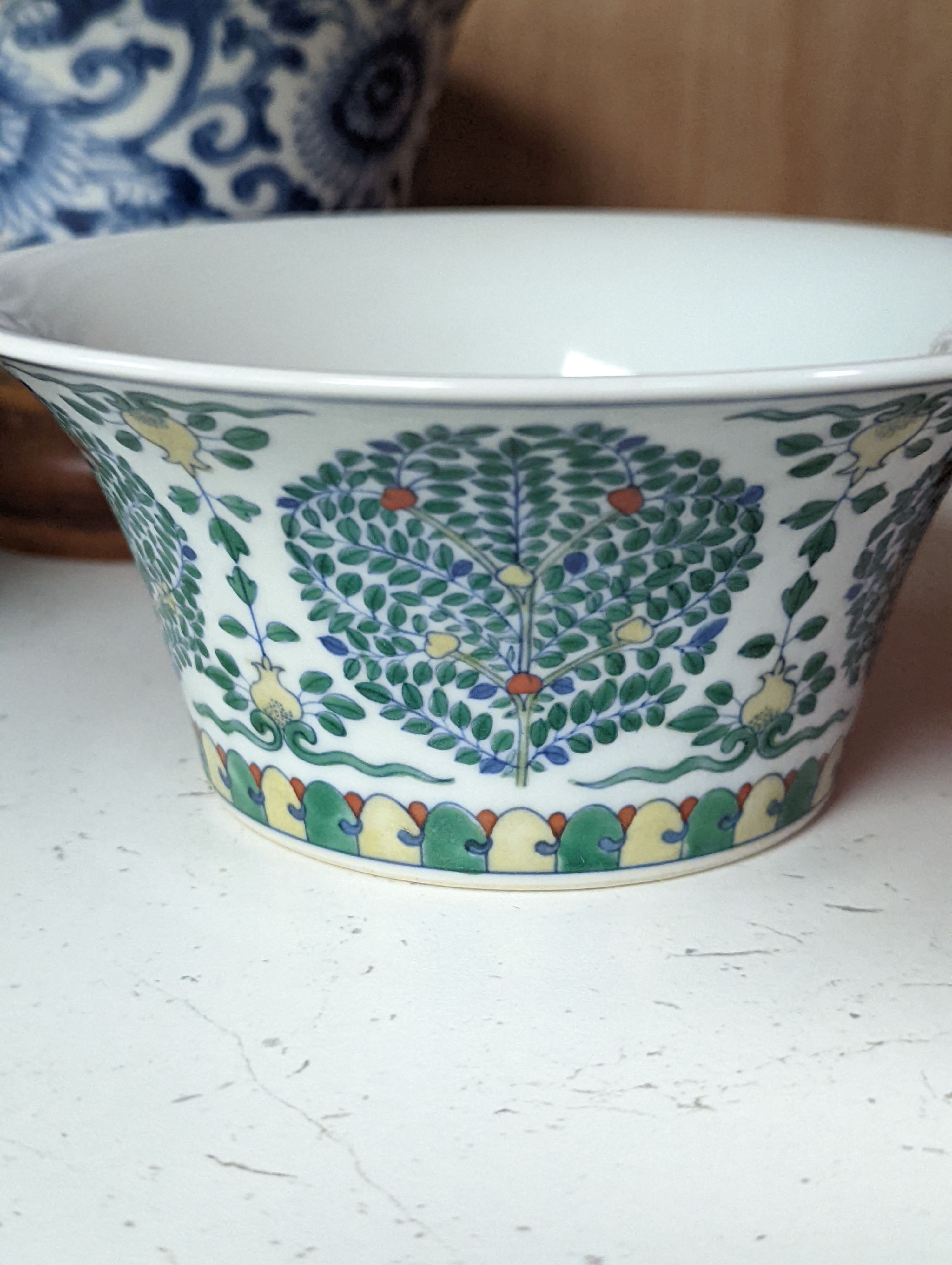 A Chinese blue and white bowl, Kangxi, 15cm. diam., a famille rose teapot stand, Yongzheng, and two doucai bowls